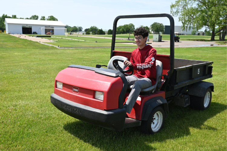 Toro Workman utility vehicle in the field at the Hancock Turfgrass Research Center.
